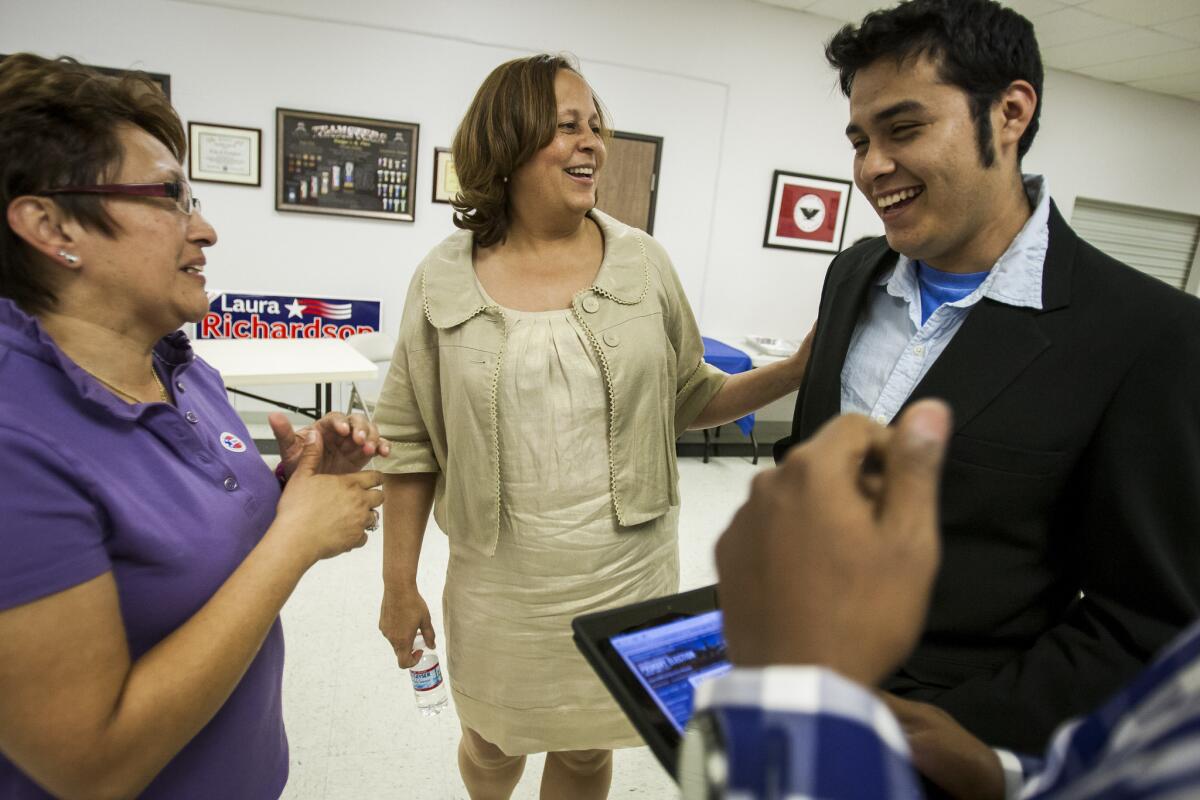 Christopher Castillo with former Democratic Rep. Laura Richardson, center, at a primary election night party in 2012. Richardson lost in the general election to Janice Hahn.