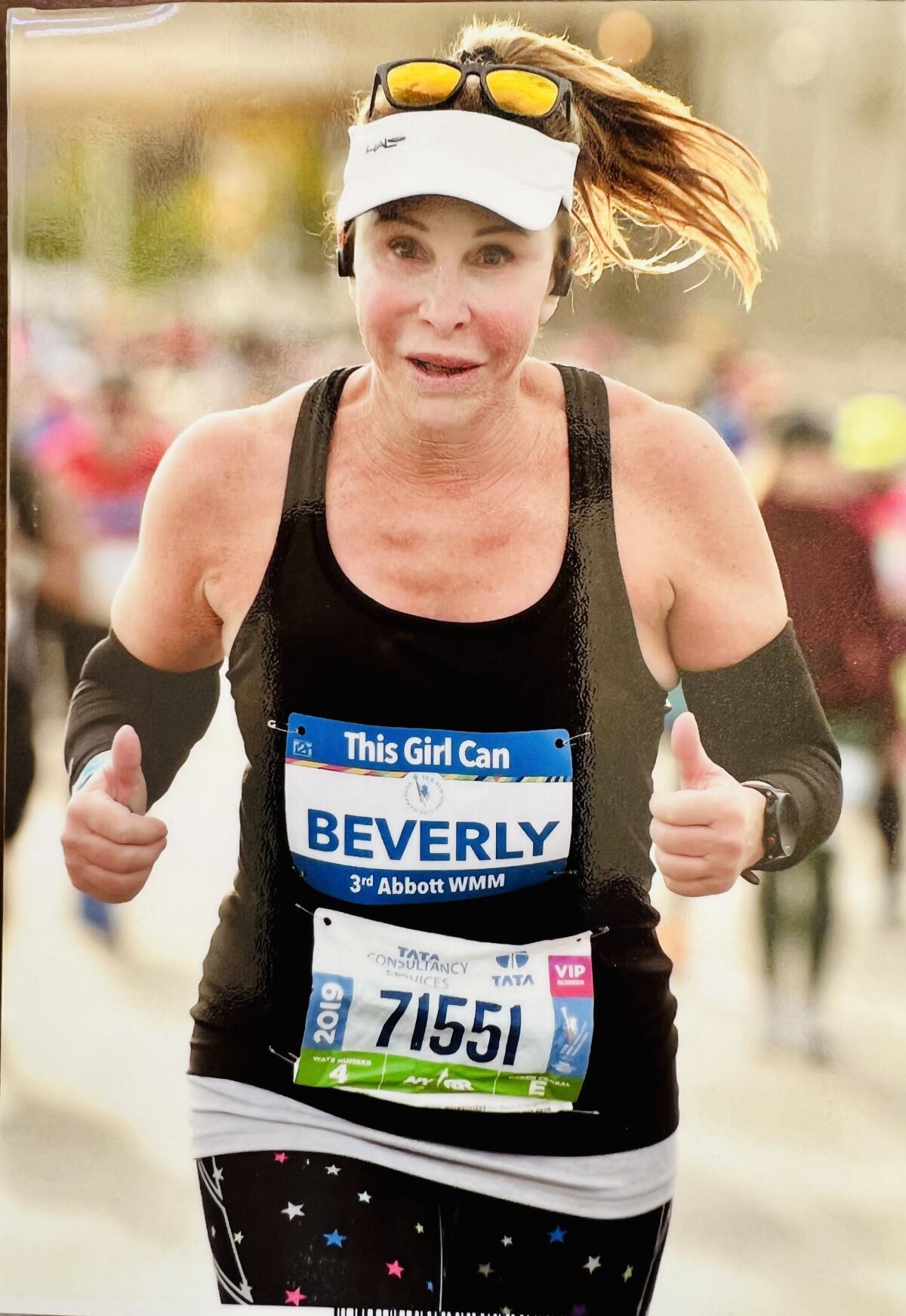 La Jolla resident Beverly Silldorf runs in one of her many marathons in recent years.