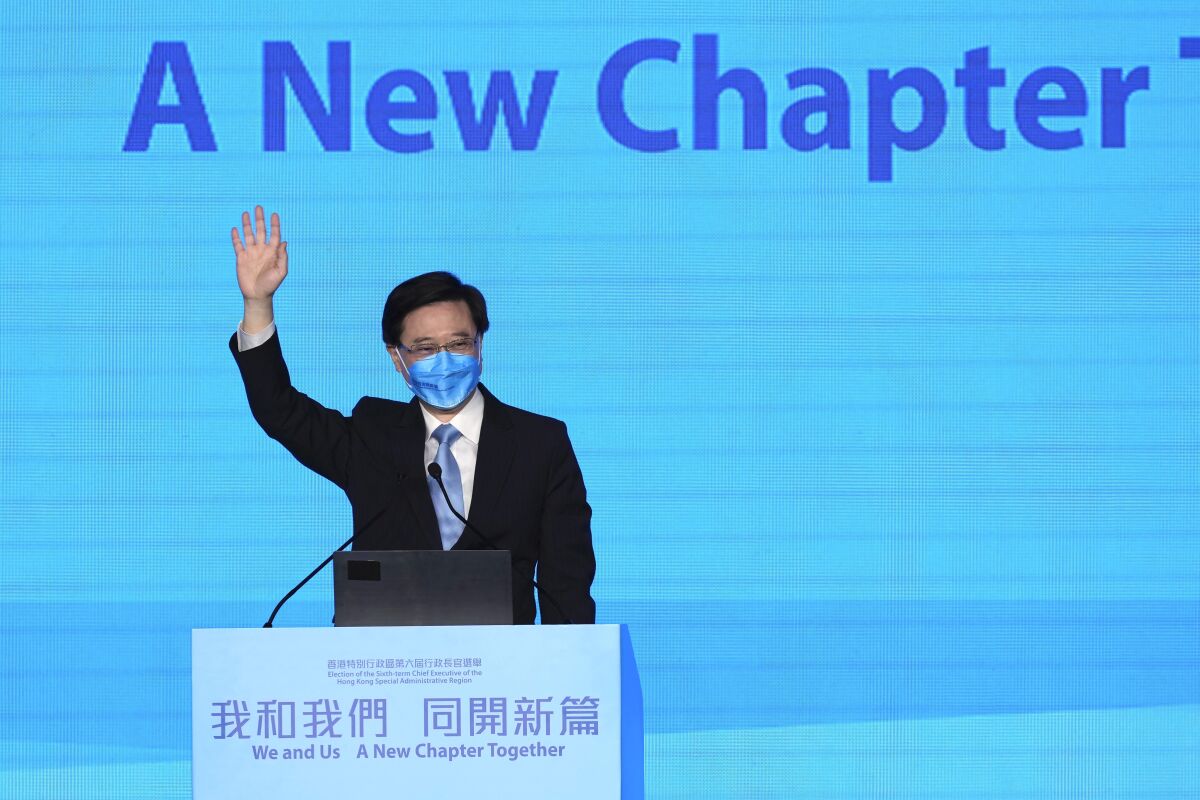 John Lee, former No. 2 official in Hong Kong, and the only candidate for the city's top job, attends his 2022 chief executive electoral campaign rally in Hong Kong, Friday, May 6, 2022. China is moving to install Lee as the new leader of Hong Kong in the culmination of a sweeping political transformation that has gutted the Asian financial center's democratic institutions and placed it ever more firmly under Beijing's control. (AP Photo/Kin Cheung)