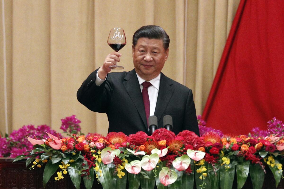Chinese President Xi Jinping makes a toast after delivering his speech at a dinner marking the 70th anniversary of the founding of the People's Republic of China.