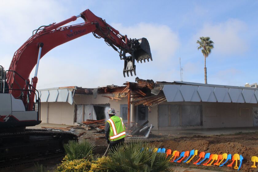 A Del Mar Heights classroom building is demolished.