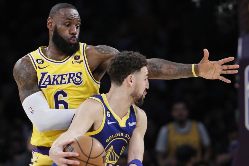 Lakers forward LeBron James (6) guards Golden State Warriors guard Klay Thompson (11)