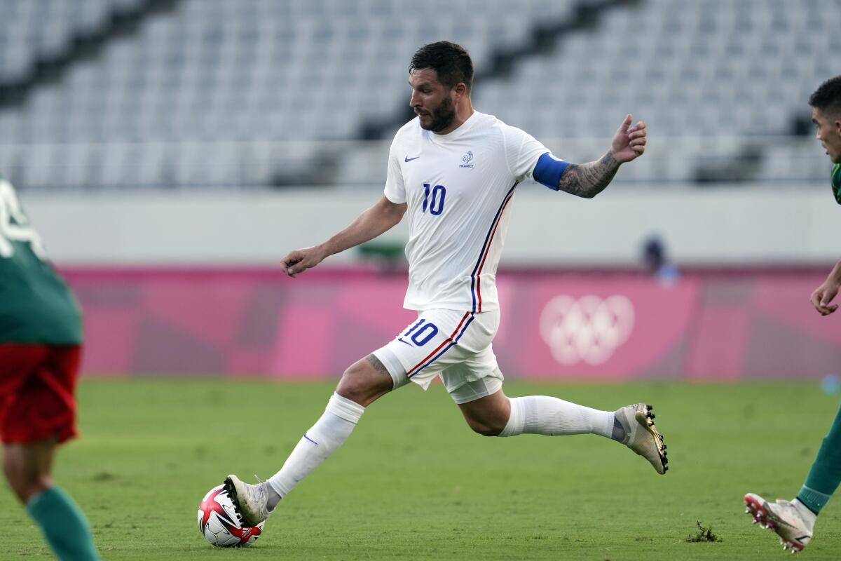 France's Andre-Pierre Gignac passes  