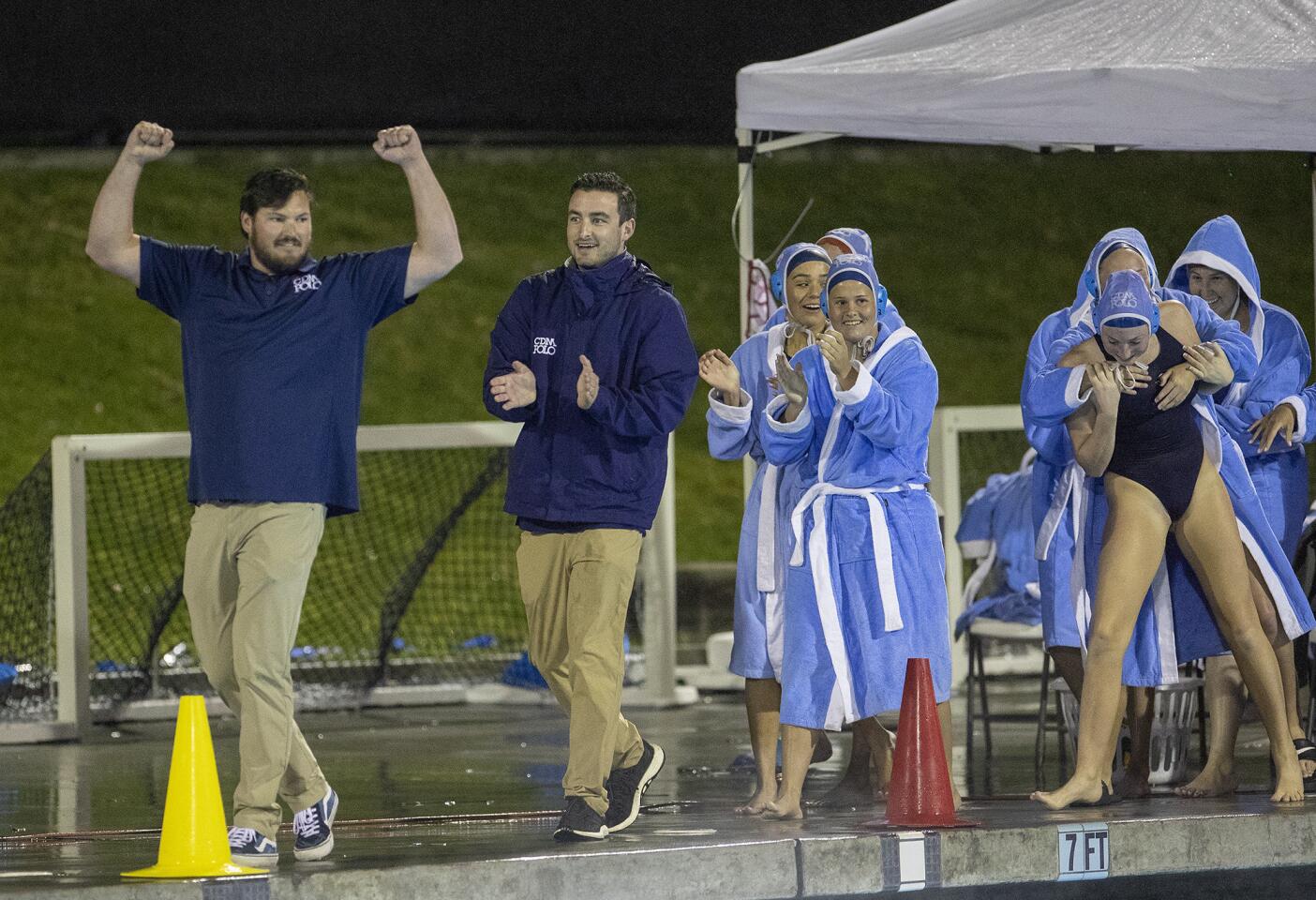 Corona del Mar High coach Justin Papa, left, and his Sea Kings celebrate after stunning Orange Lutheran 8-7 in the semifinals of the CIF Southern Section Division 1 playoffs at Irvine's Woollett Aquatics Center on Wednesday.