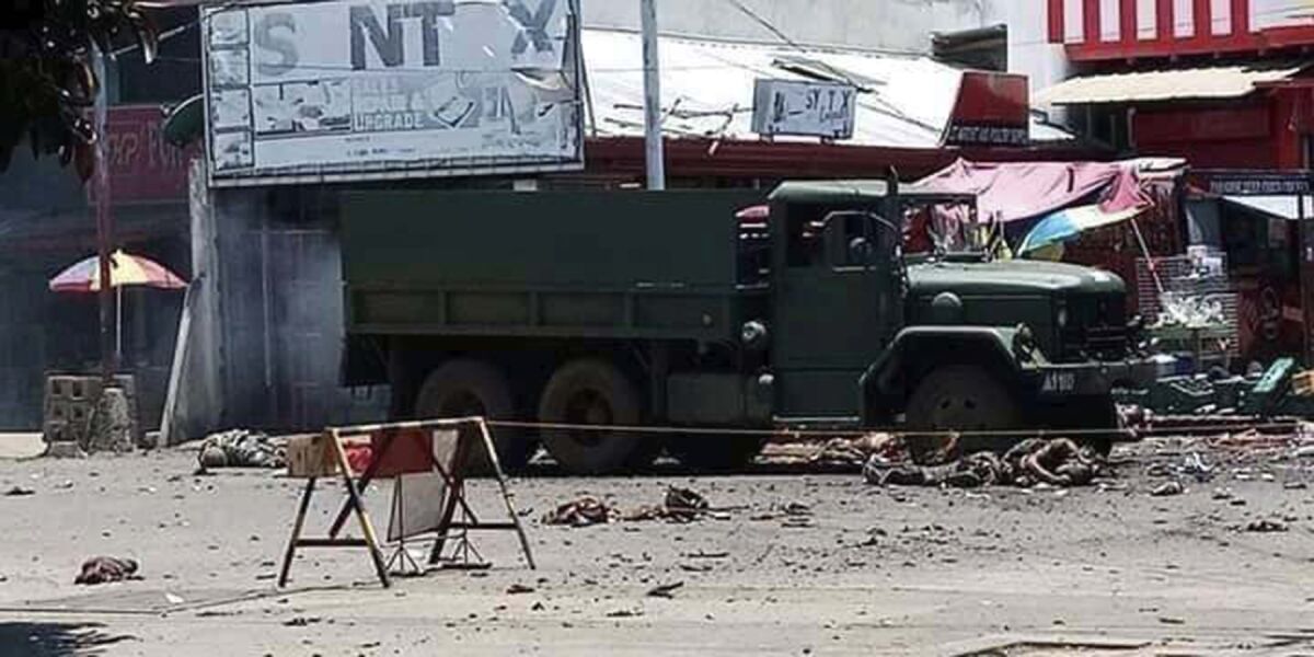 Military truck at an area where a bomb exploded in Jolo, Philippines on Monday