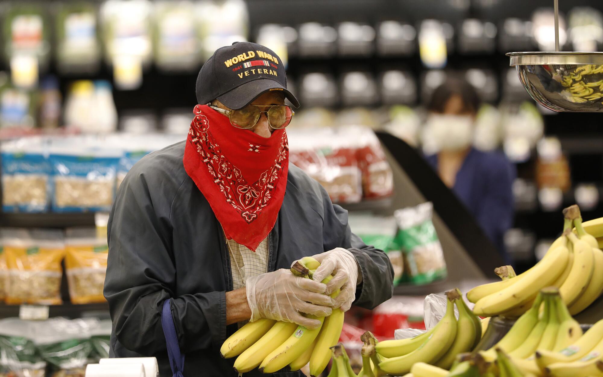 A 93-year-old World War II veteran shops at a Vons in Torrance.
