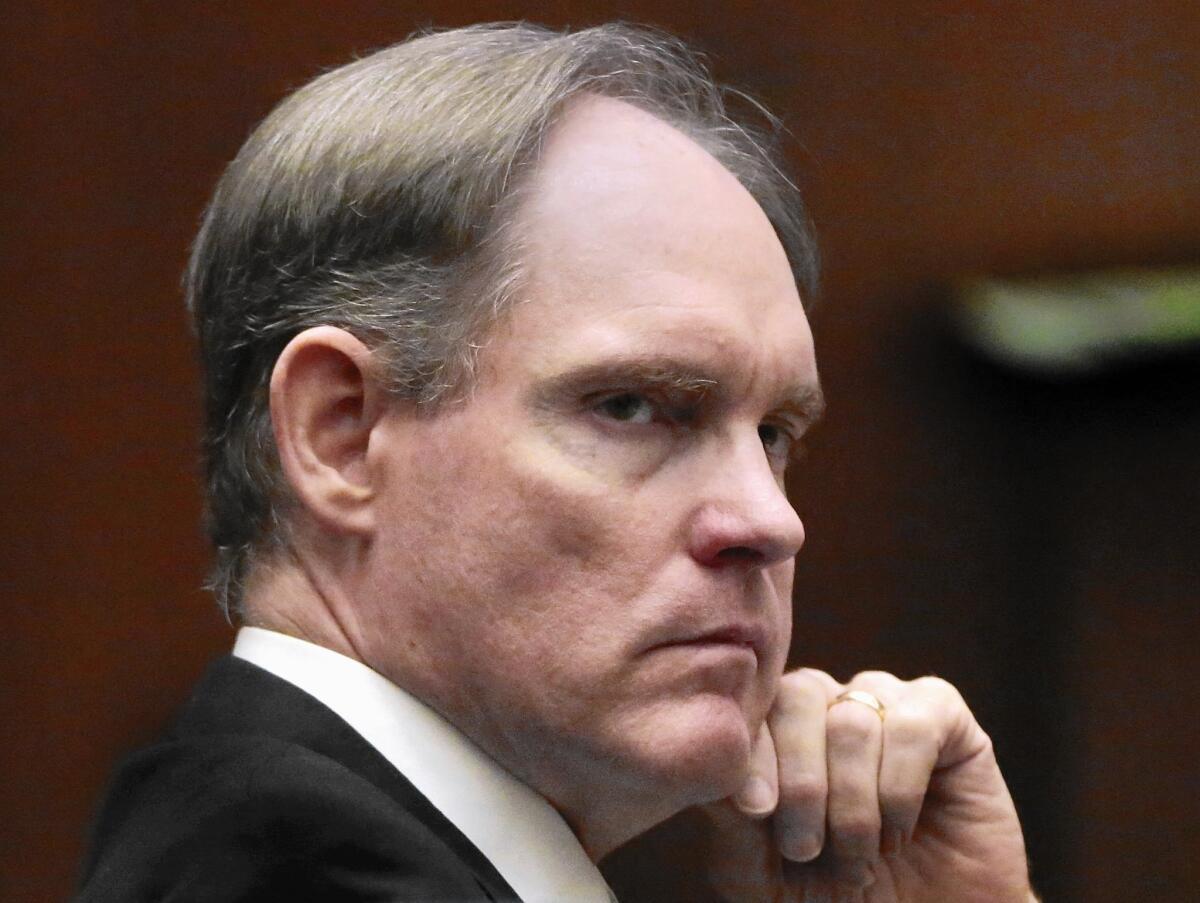 Cameron Brown listens during his attorney's opening statements in Los Angeles County Superior Court. In his two previous trials, jurors have been unable to agree on a verdict.