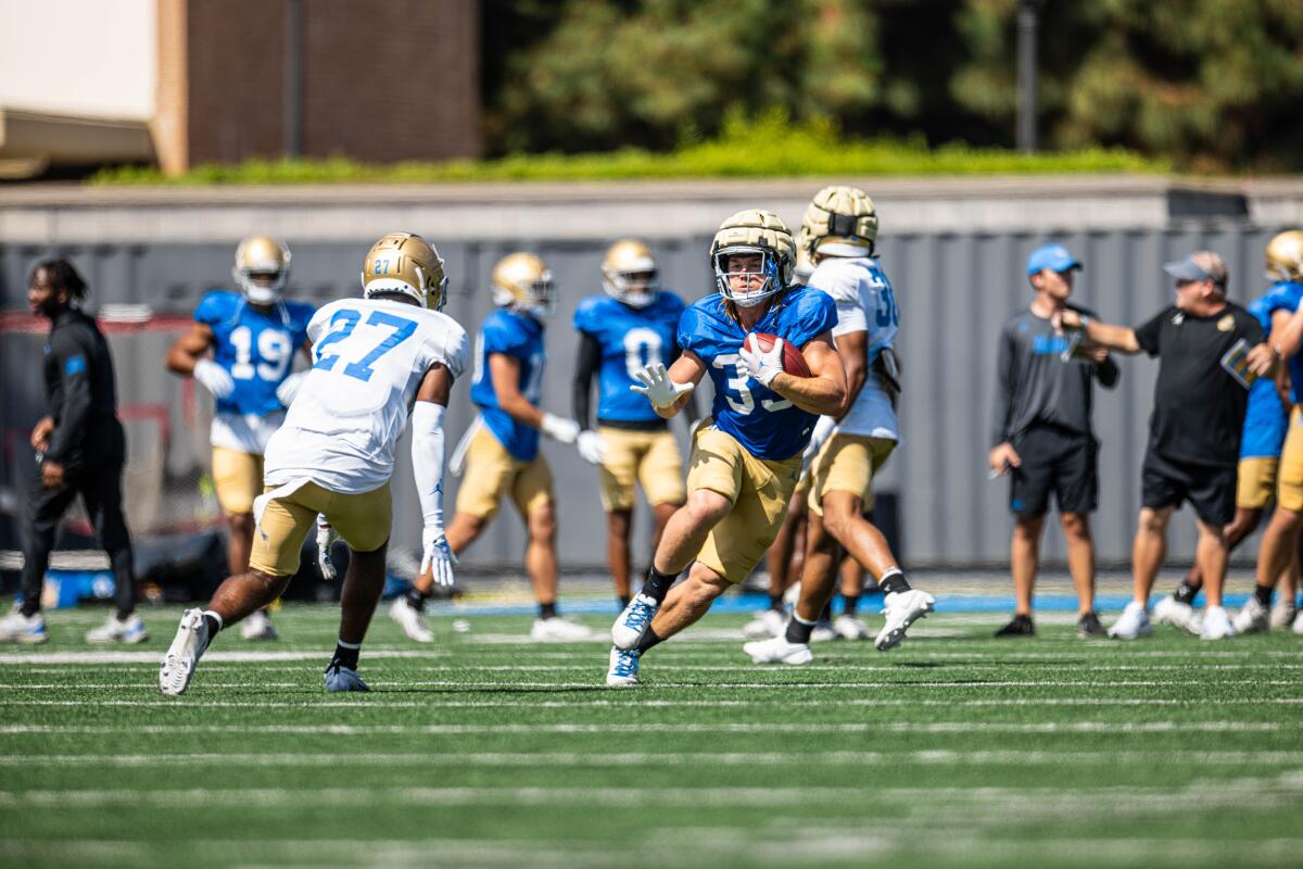 UCLA running back Carson Steele carries the ball during practice on Aug. 15.