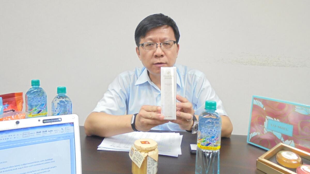 Taiyen Biotech Vice President Chen Shih-hui displays salt-based products.