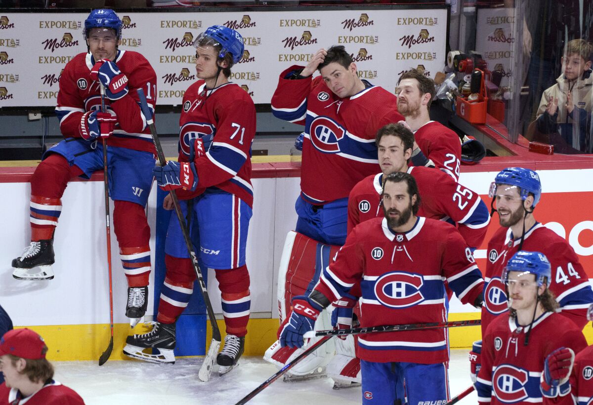 Montreal Canadiens goaltender Carey Price lines up with teammates for a ceremony following an NHL hockey game against the Florida Panther on Friday, April 29, 2022, in Montreal, on the closing night of the regular season. (Paul Chiasson/The Canadian Press via AP)