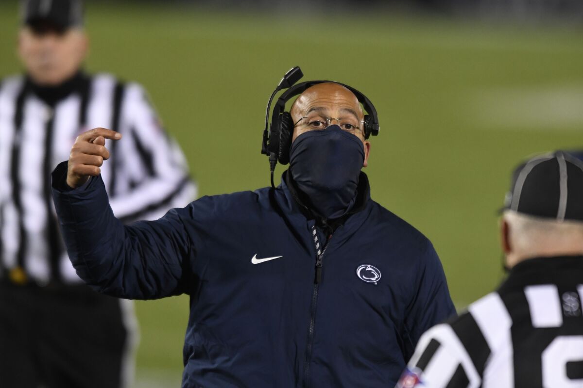Penn State head coach James Franklin talks with an official during the fourth quarter of the team's NCAA college football game against Ohio State in State College, Pa., on Saturday, Oct. 31, 2020. Ohio State won 38-25. (AP Photo/Barry Reeger)