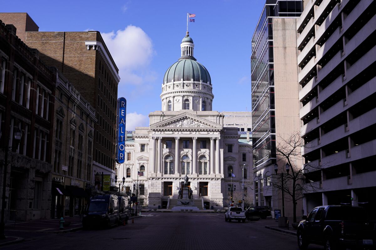 FILE - This Jan. 15, 2021, file photo, shows the Indiana Statehouse in Indianapolis. A federal judge ruled Tuesday, Aug. 10, 2021, that several of Indiana’s laws restricting abortion are unconstitutional, including the state’s ban on telemedicine consultations between doctors and women seeking abortions. (AP Photo/Michael Conroy, File)