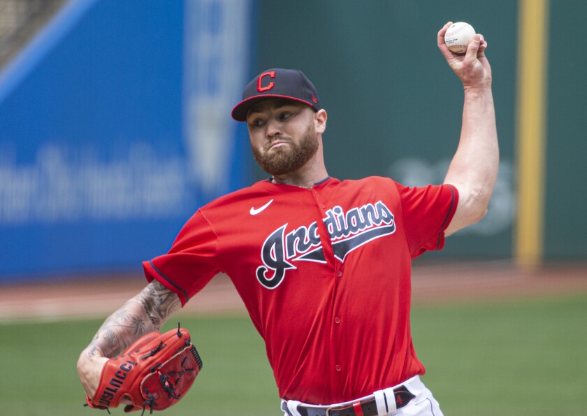 Cleveland Indians starting pitcher Logan Allen delivers against the Detroit Tigers during the first inning of a baseball game in Cleveland, Sunday, April 11, 2021. (AP Photo/Phil Long)