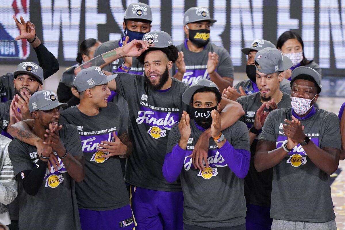 The Lakers celebrate after beating the Denver Nuggets in the Western Conference finals.
