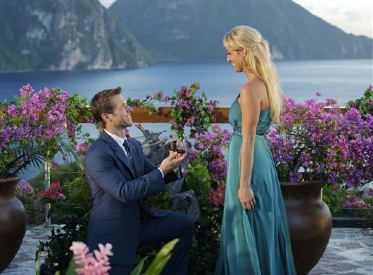 In this publicity image released by ABC, bachelor Jake Pavelka, presents a ring to Vienna Giraldi after the final rose ceremony on the season finale of "The Bachelor: On the Wings of Love," Monday, March 1, 2010. (AP Photo/ABC, Mark Brendel)