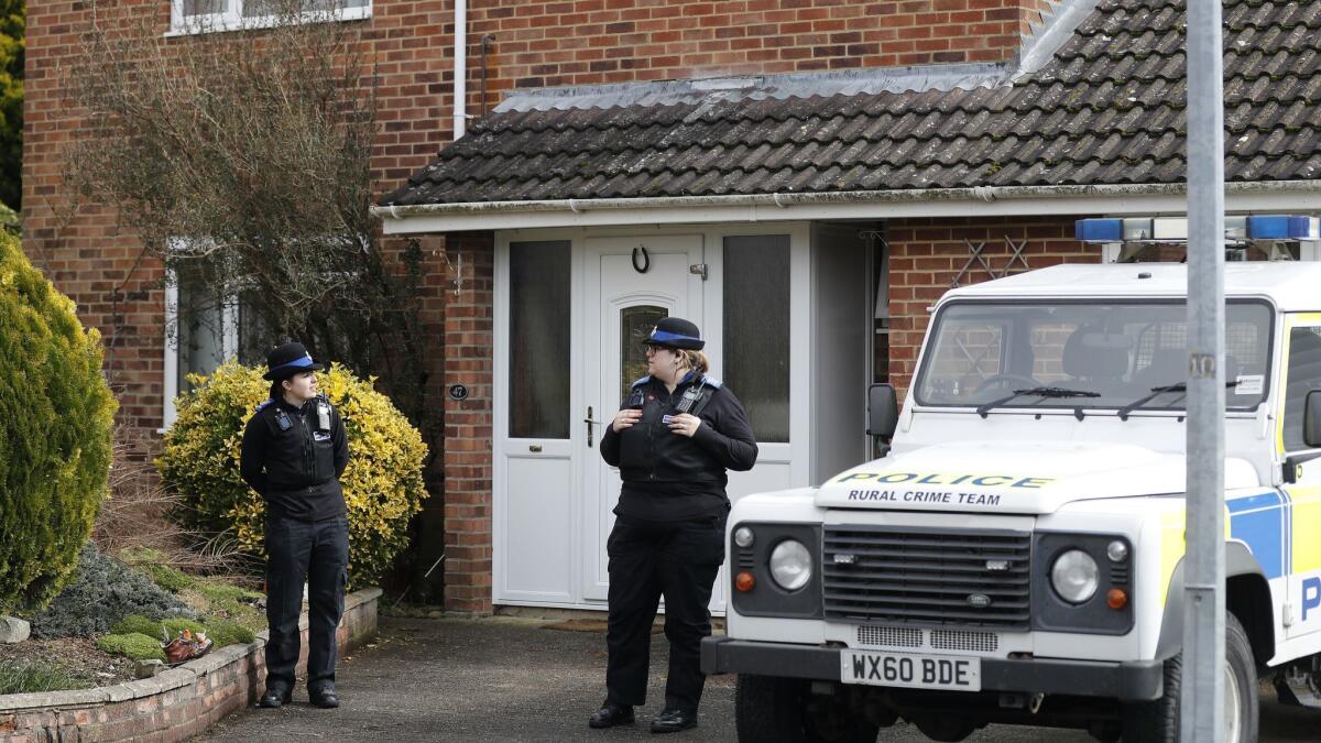 Police officers outside the house of former Russian spy Sergei Skripal in Salisbury, England.