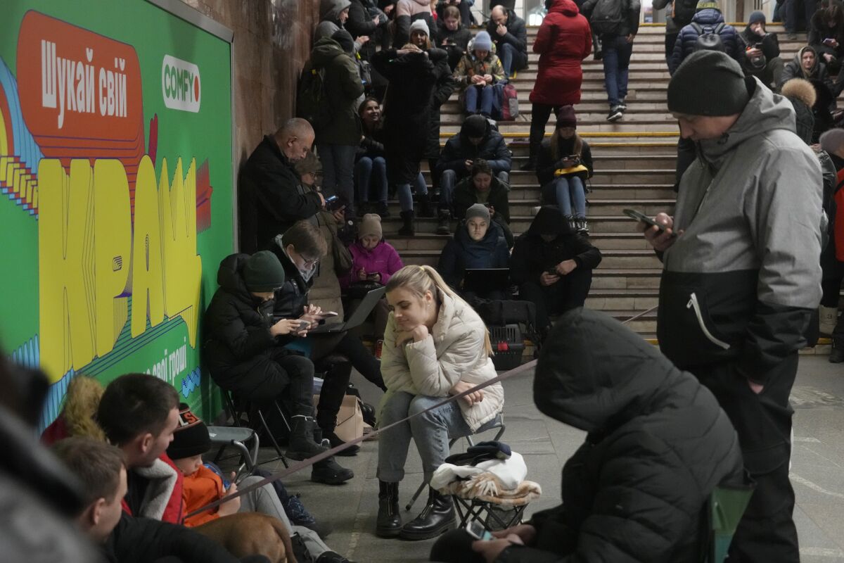 People sheltering inside subway station during a rocket attack in Kyiv, Ukraine