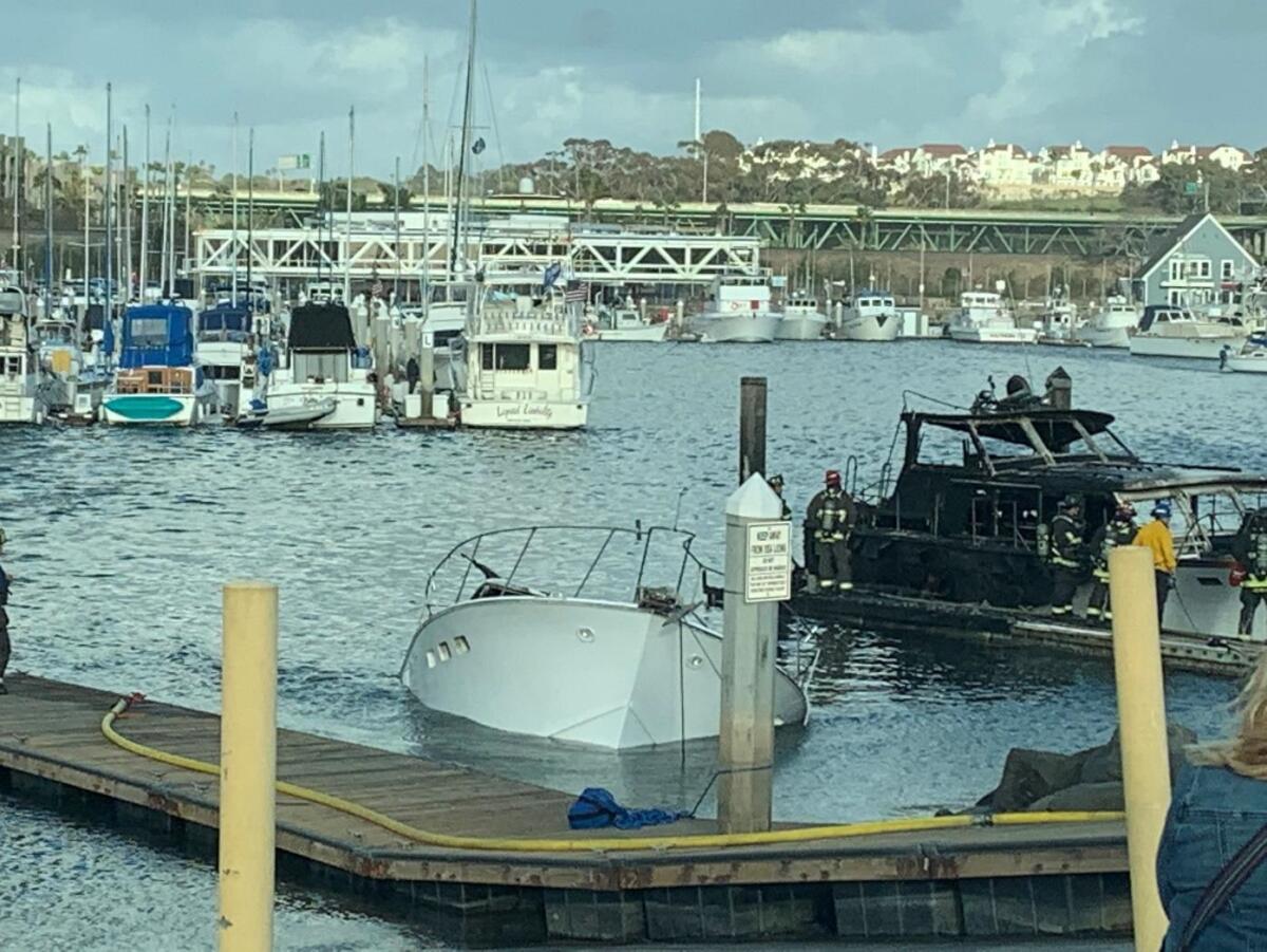A 40-foot boat that caught fire Monday in Oceanside ended up partially sinking; it was unclear if second boat was salvageable