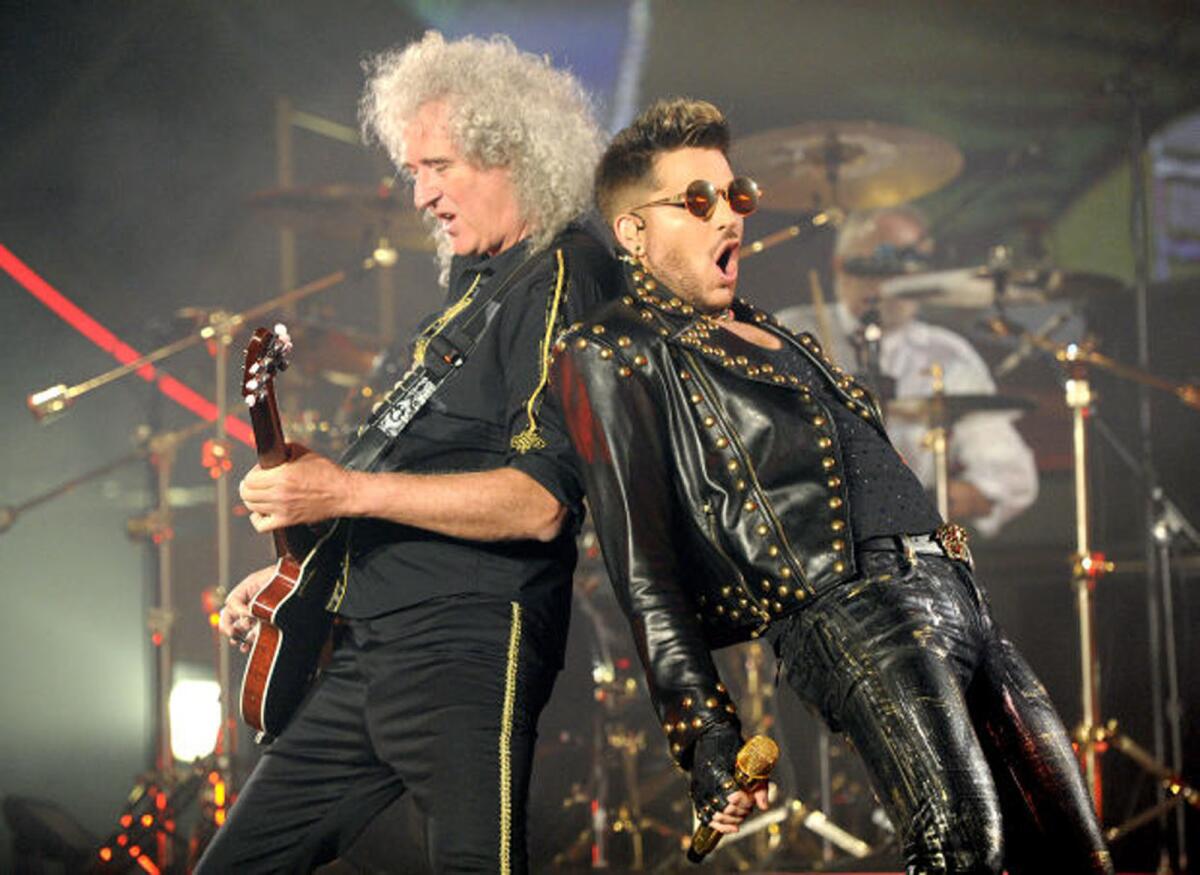 Brian May, left, and Adam Lambert perform at the Forum in 2014.