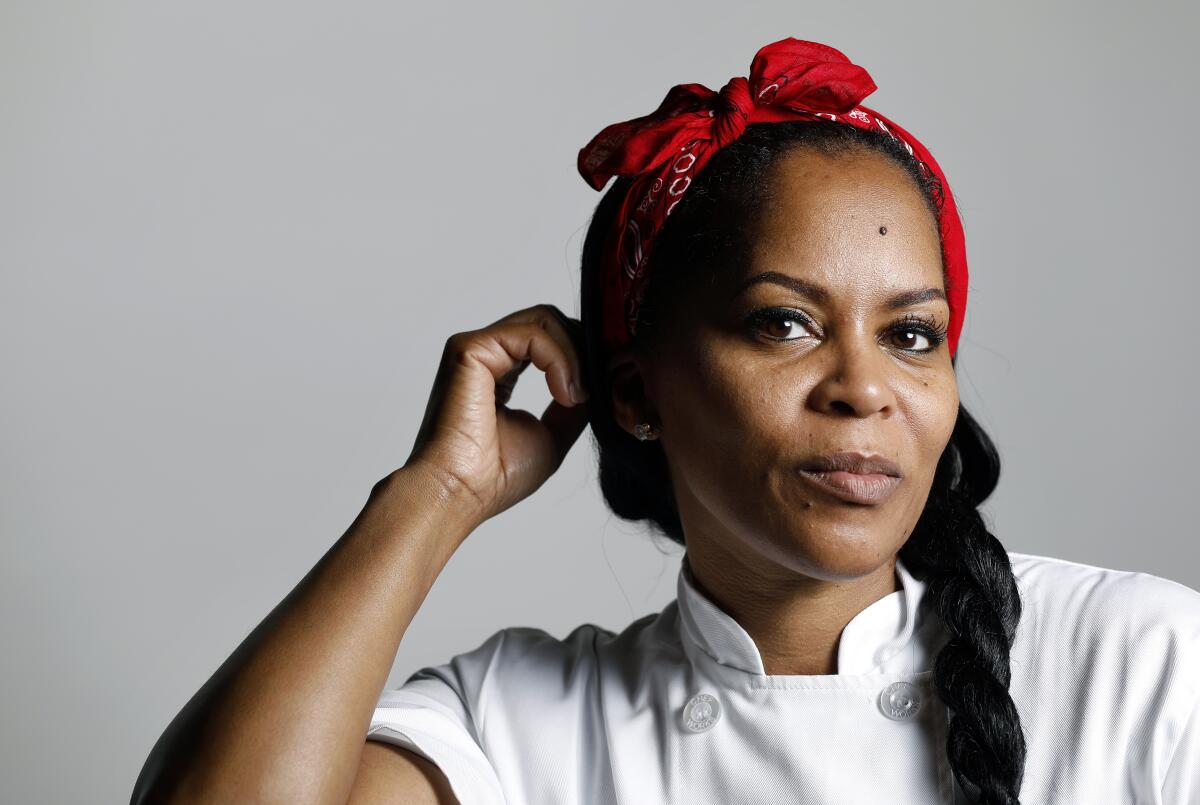 A woman with a long braid and a red kerchief.