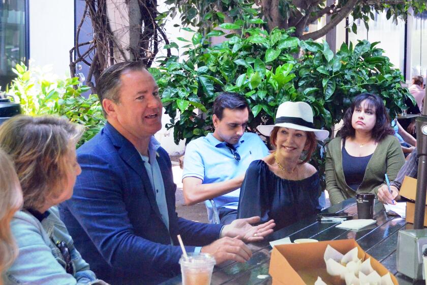 Newport Beach Mayor Will O'Neill hosts Coffee With the Mayor for the community at Haute Cakes Caffe.