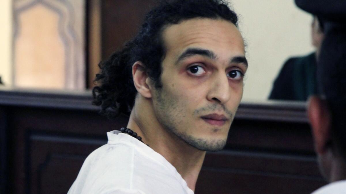 Egyptian photojournalist Mahmoud Abou Zeid, known by his nickname Shawkan, appears before a judge in 2015 after spending more than 600 days in prison in Cairo, Egypt.