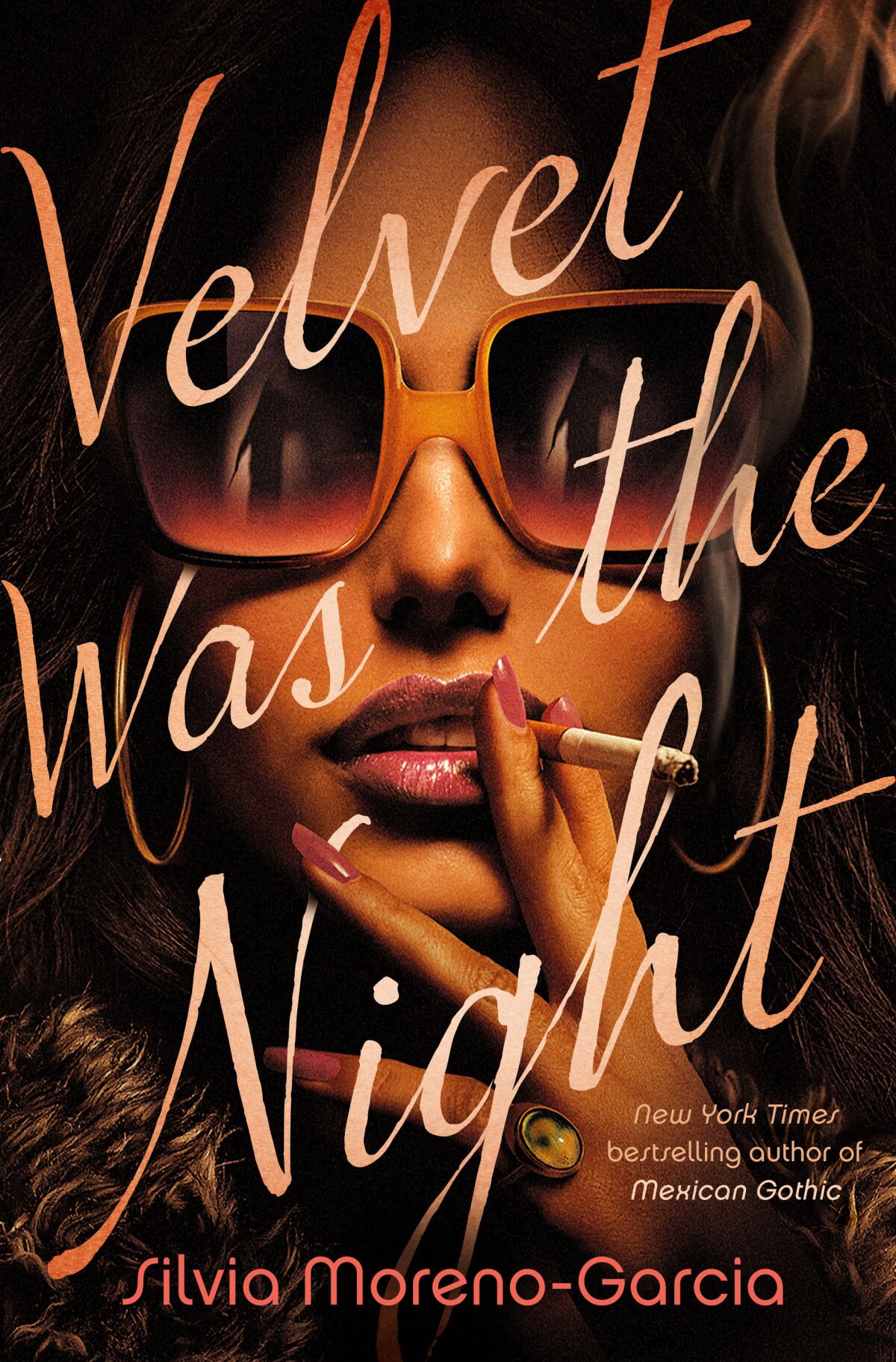 A woman smoking and wearing sunglasses on the cover of the book "Velvet Was the Night" by Silvia Moreno-Garcia