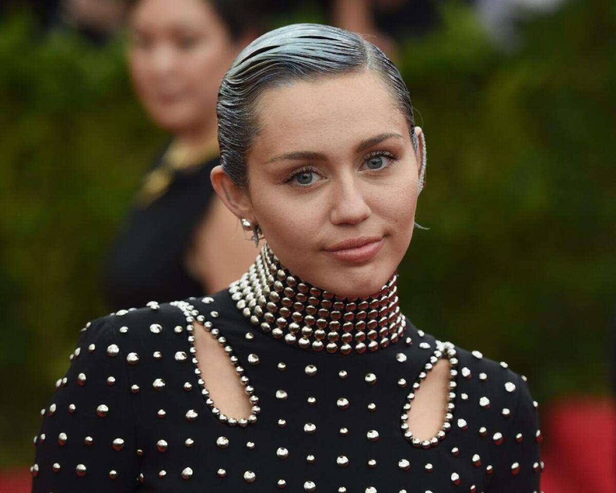 Miley Cyrus arrives at the 2015 Metropolitan Museum of Art's Costume Institute Gala benefit in honor of the museum's latest exhibit, "China: Through the Looking Glass," on May 4 in New York.