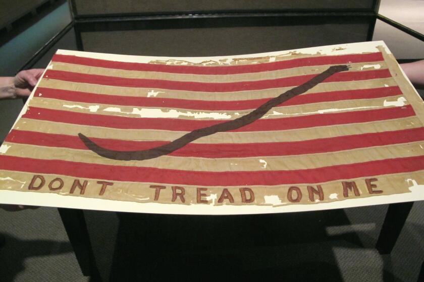 An old American naval flag touts the phrase: "Don't tread on me." History's next miniseries, "Sons of Liberty," will look at the origins of the American Revolution.