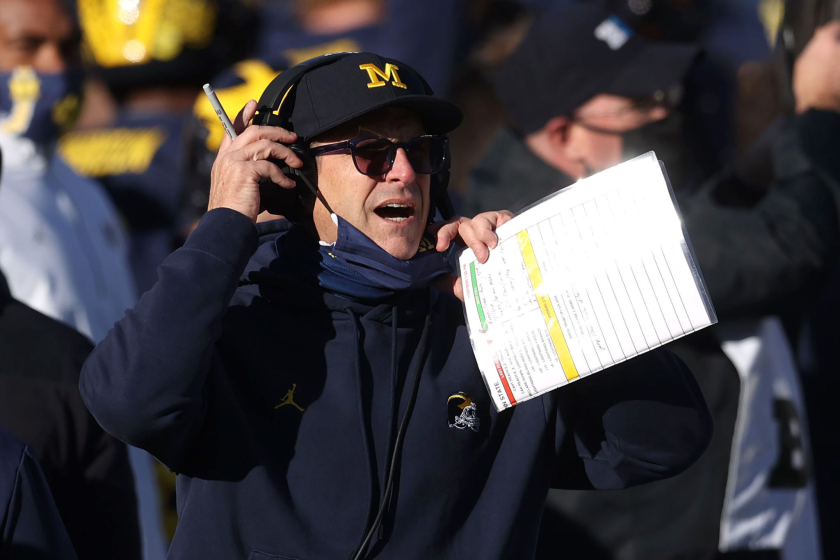 ANN ARBOR, MICHIGAN - NOVEMBER 28: Head coach Jim Harbaugh of the Michigan Wolverines reacts.