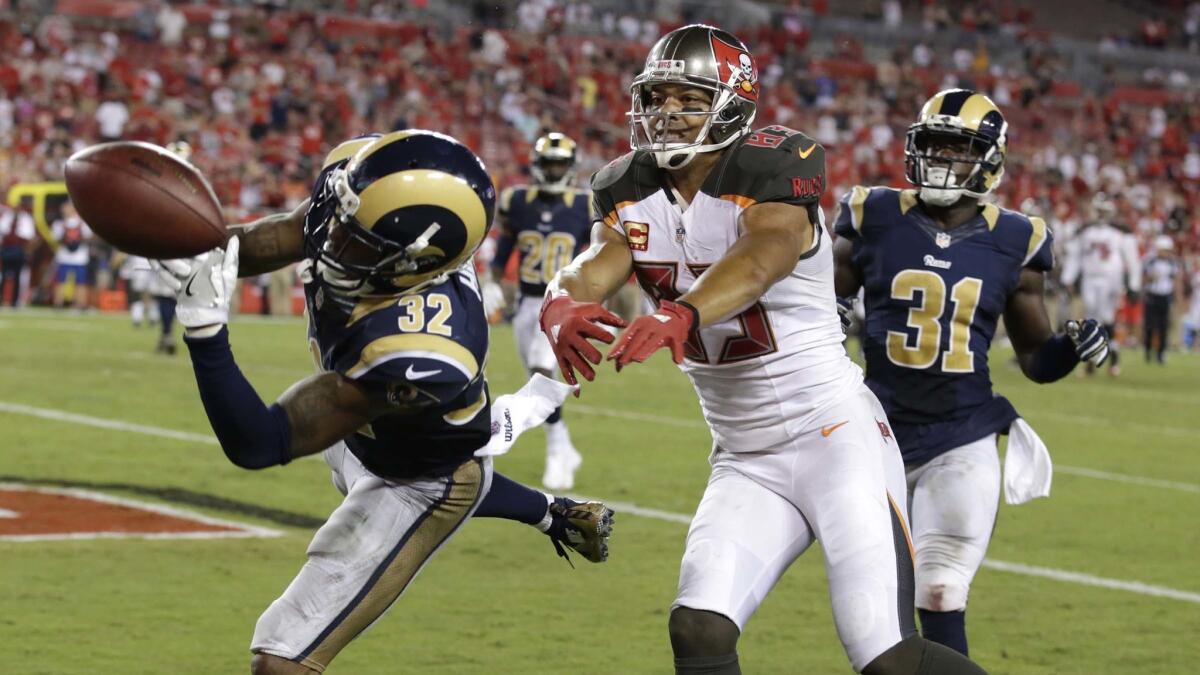 Rams defensive back Troy Hill breaks up a pass in the end zone intended for Buccaneers receiver Vincent Jackson with seconds remaining in the game.