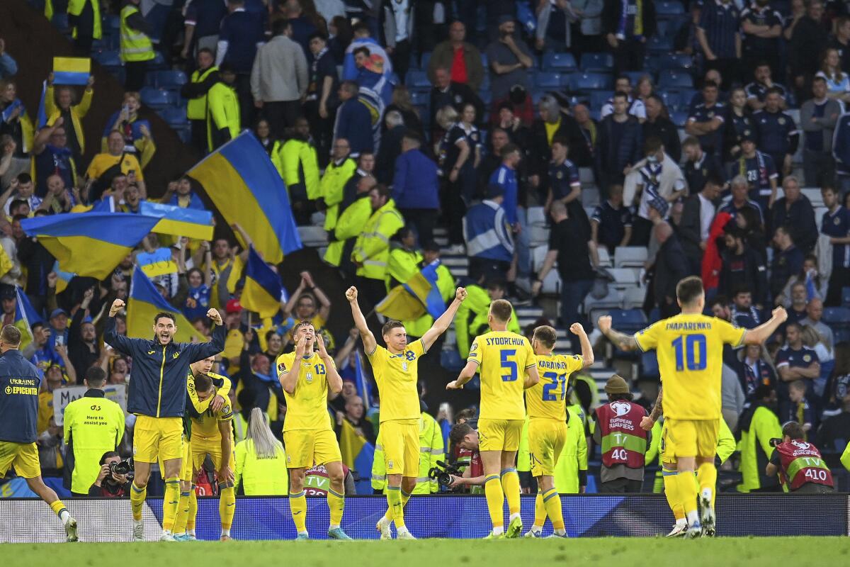 The Ukrainian team celebrate at the final whistle of the Worl