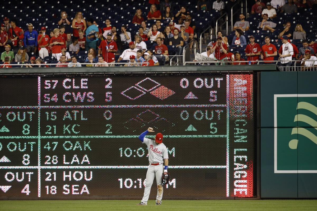 Philadelphia Phillies right fielder Bryce Harper deals with hecklers during the eighth inning of a game against Washington on Sept. 25 at National Park.