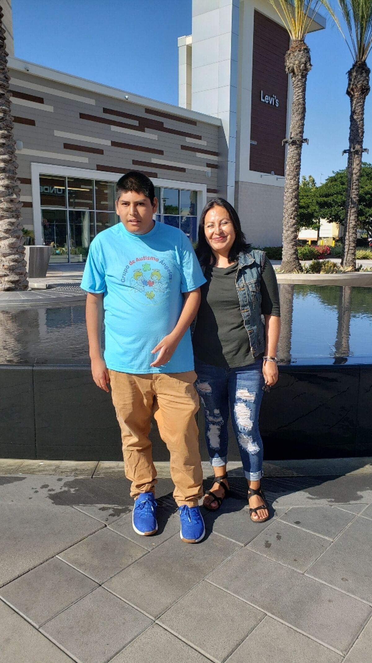 Manny Perez, 15, with his mother, Michaela Corona.