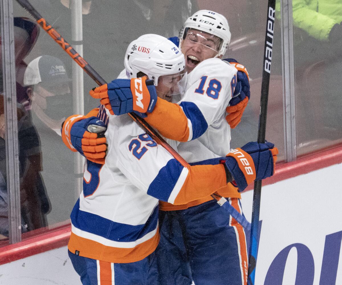 New York Islanders' Brock Nelson (29) celebrates with Anthony Beauvillier (18) after scoring against the Montreal Canadiens during the second period of an NHL hockey game Thursday, Nov. 4, 2021, in Montreal. (Ryan Remiorz/The Canadian Press via AP)