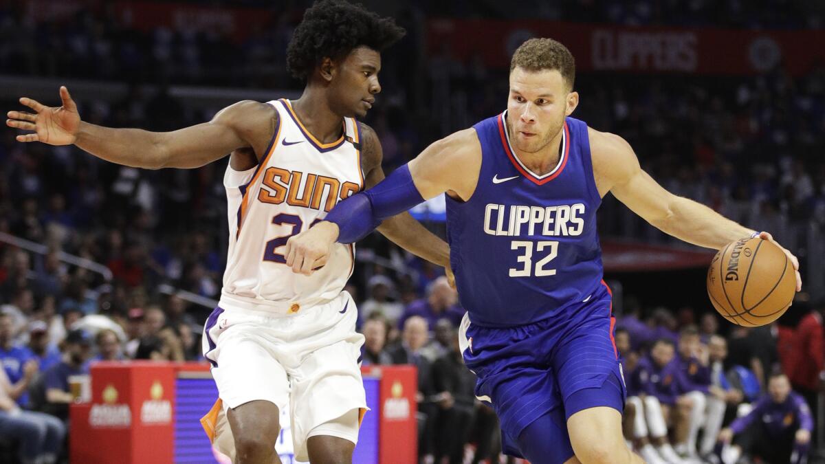 Suns forward Josh Jackson tries to cut off a drive by Clippers forward Blake Griffin during a game Oct. 22.