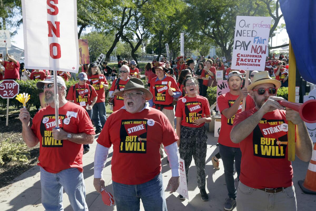 Faculty from campuses all over California, joined by students, rally over salary issues outside the California State University Board of Trustees meeting in Long Beach.