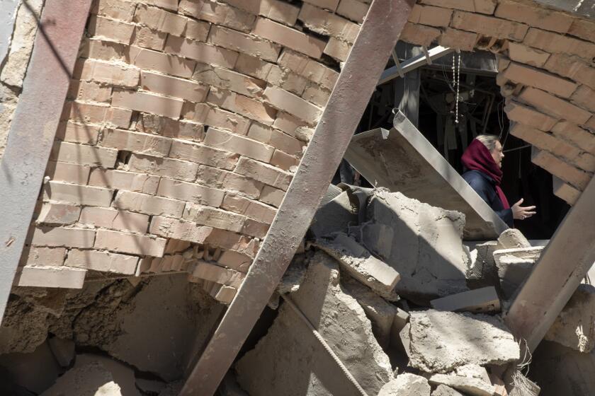 TEHRAN, IRAN - APRIL 7: People walk through the debris at Sharif University of Technology which was hit by US-Israeli strikes on April 7, 2026 in Tehran, Iran. Sharif University of Technology is one of Iran’s leading scientific universities. The United States and Israel continued their joint attack on Iran that began. Iran retaliated by firing waves of missiles and drones at Israel, and targeting U.S. allies in the region. (Photo by Majid Saeedi/Getty Images)