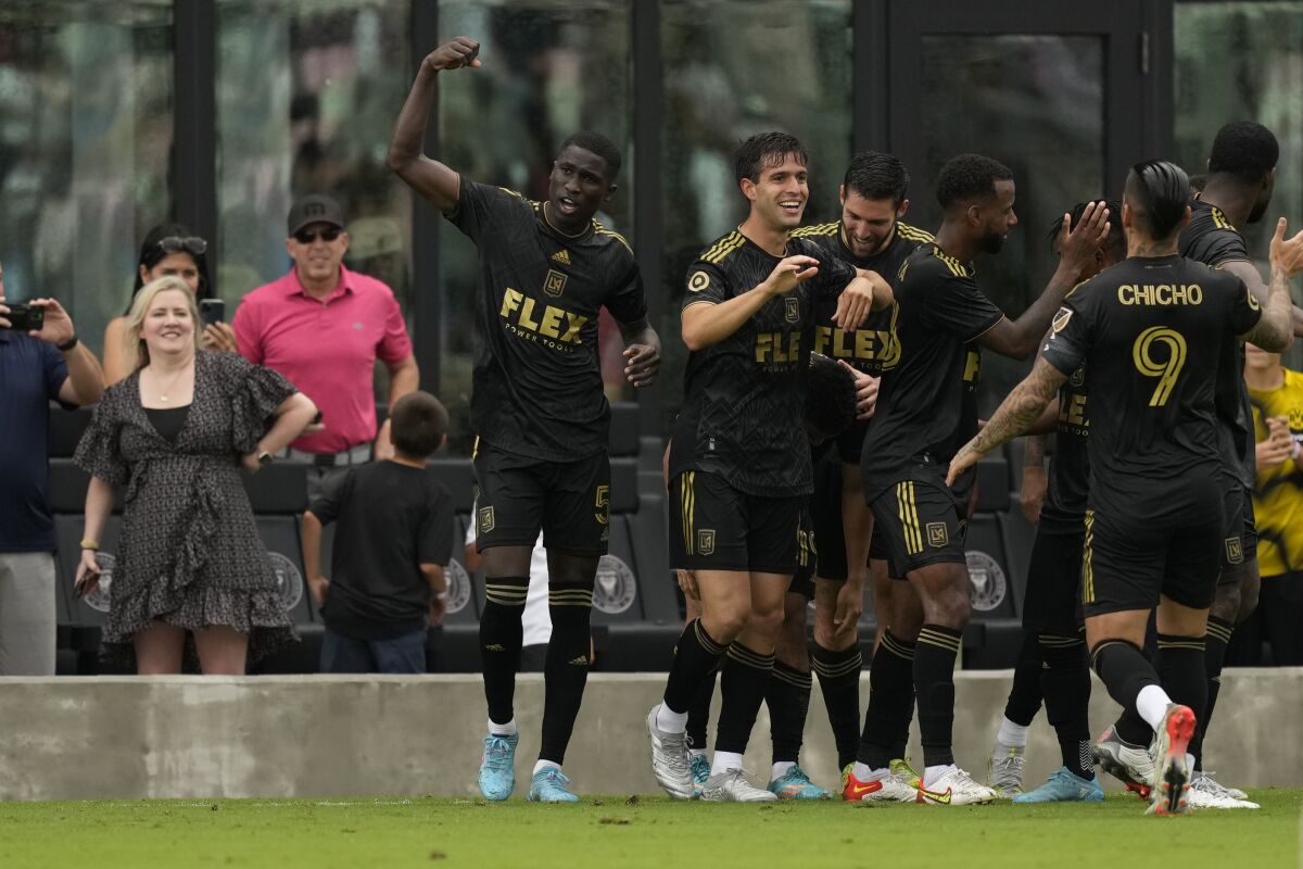 Los Angeles FC players celebrate their side's second goal against Inter Miami.
