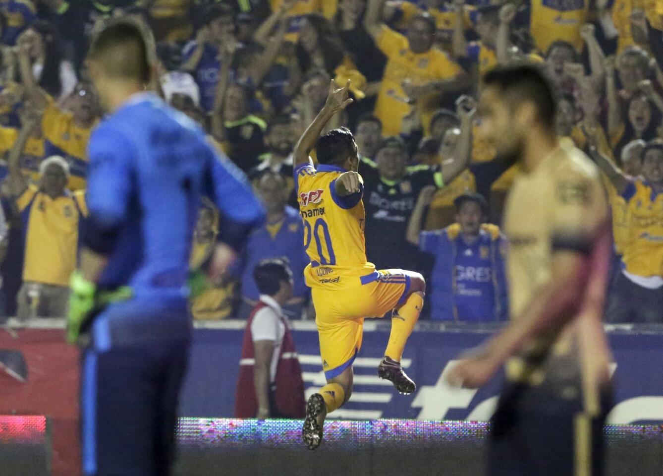 Football Soccer - Tigres v Pumas - The first leg of their Mexican first division final soccer match - Universitario stadium, Monterrey, Mexico - 10/12/15 Tigres' Javier Aquino (20) celebrates after scoring against Pumas. REUTERS/Daniel Becerril ** Usable by SD ONLY **