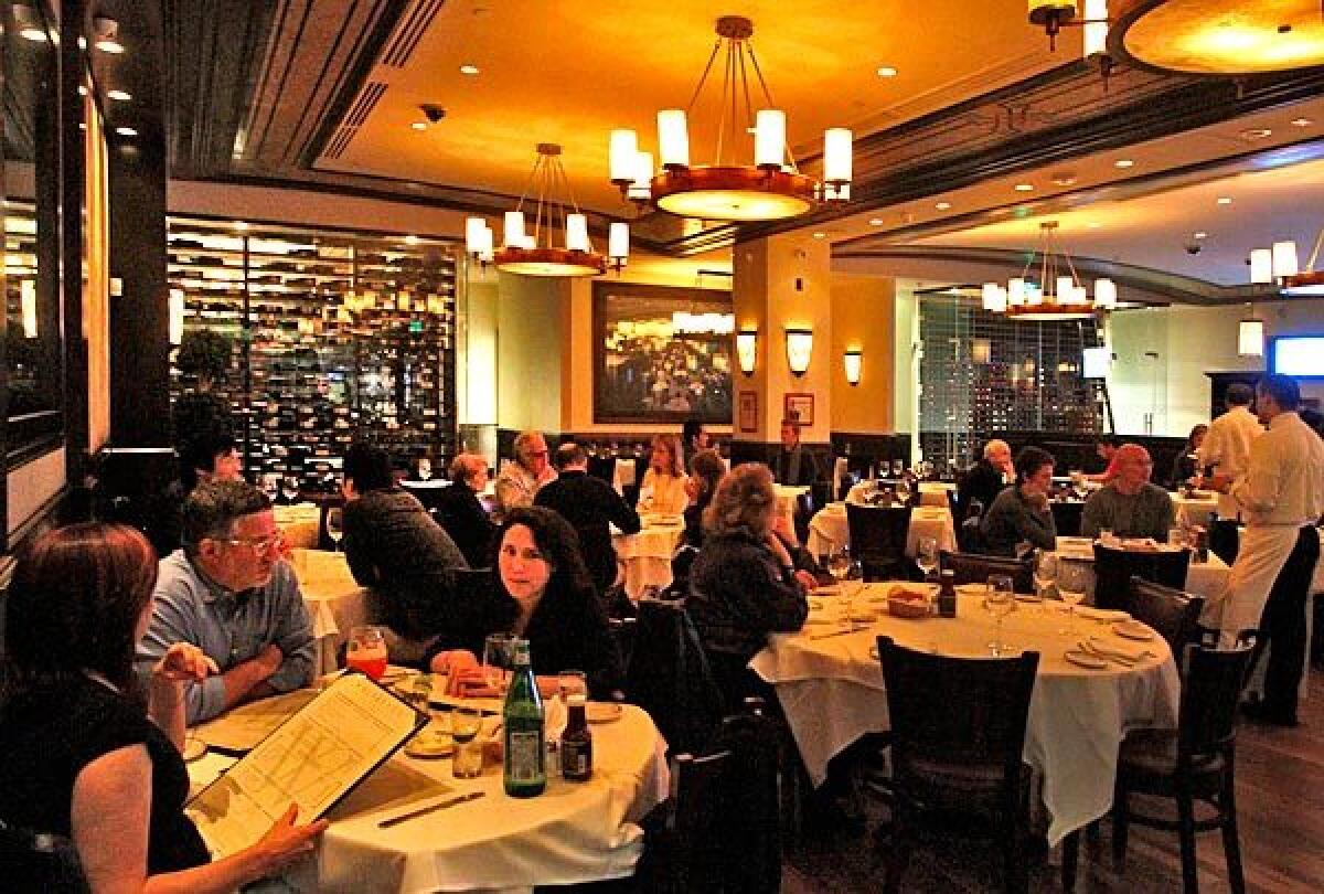 Widely spaced tables and oversized lighting fixtures are features at Wolfgang's Steakhouse.