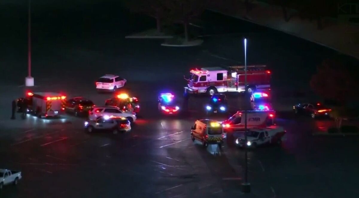 Sheriff's deputies, ambulances and fire personnel respond to a shooting at a Victorville mall.
