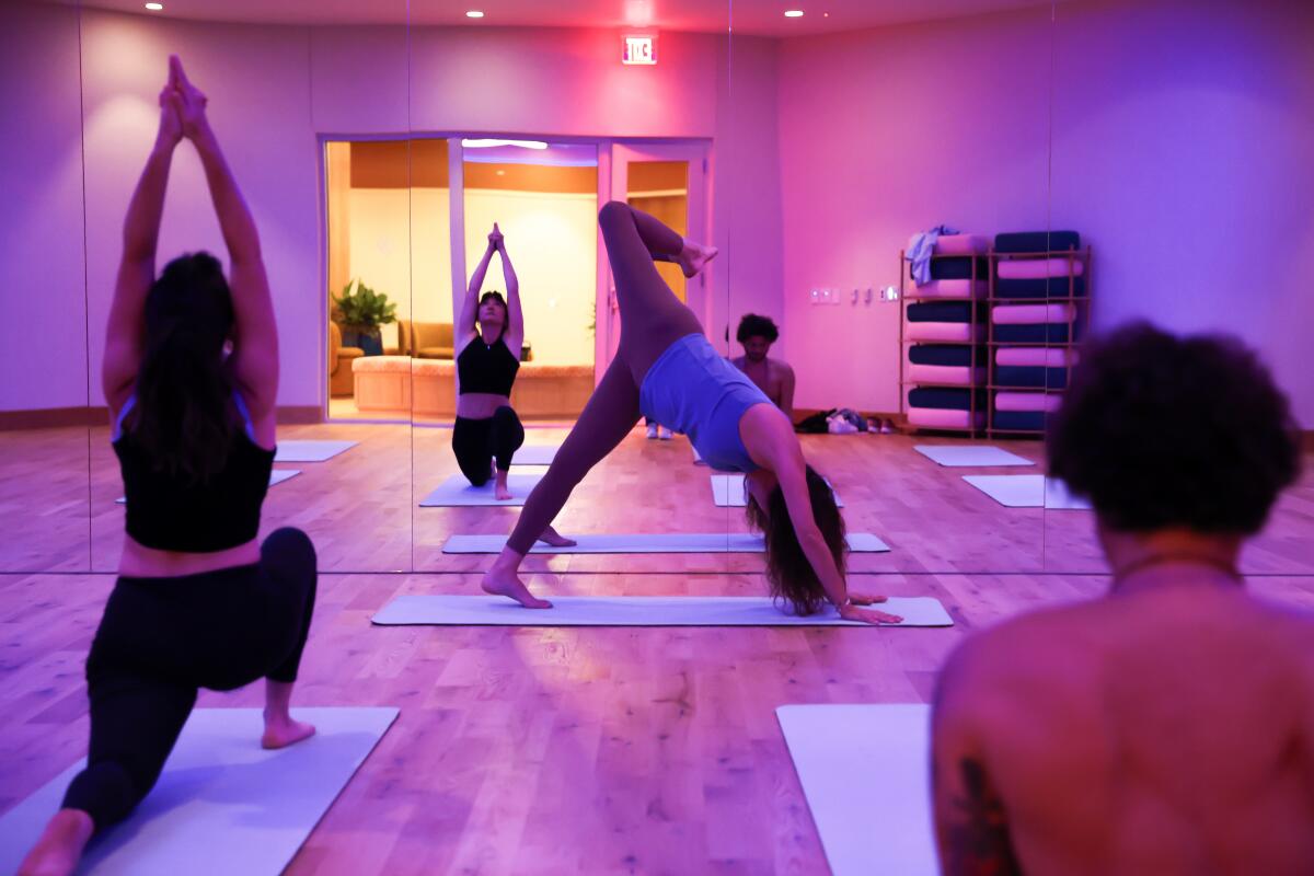 Love.Life team members demonstrate a yoga class.