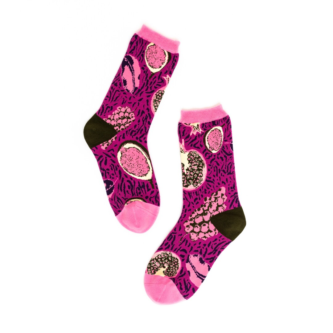 Bright pink socks with fruit designs