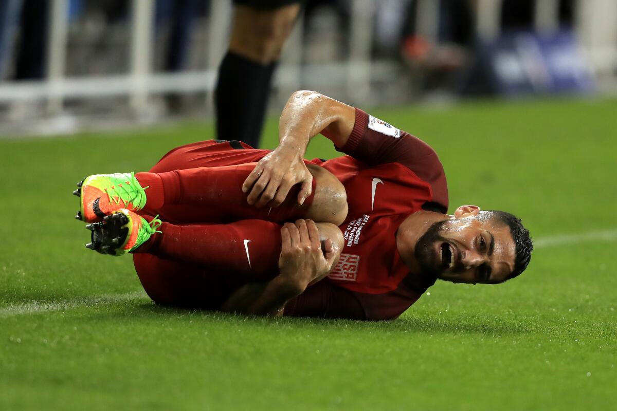 Sebastian Lletget reacts after being tripped by Honduras's Ever Alvarado during their FIFA 2018 World Cup Qualifier at Avaya Stadium on March 24, 2017 in San Jose.