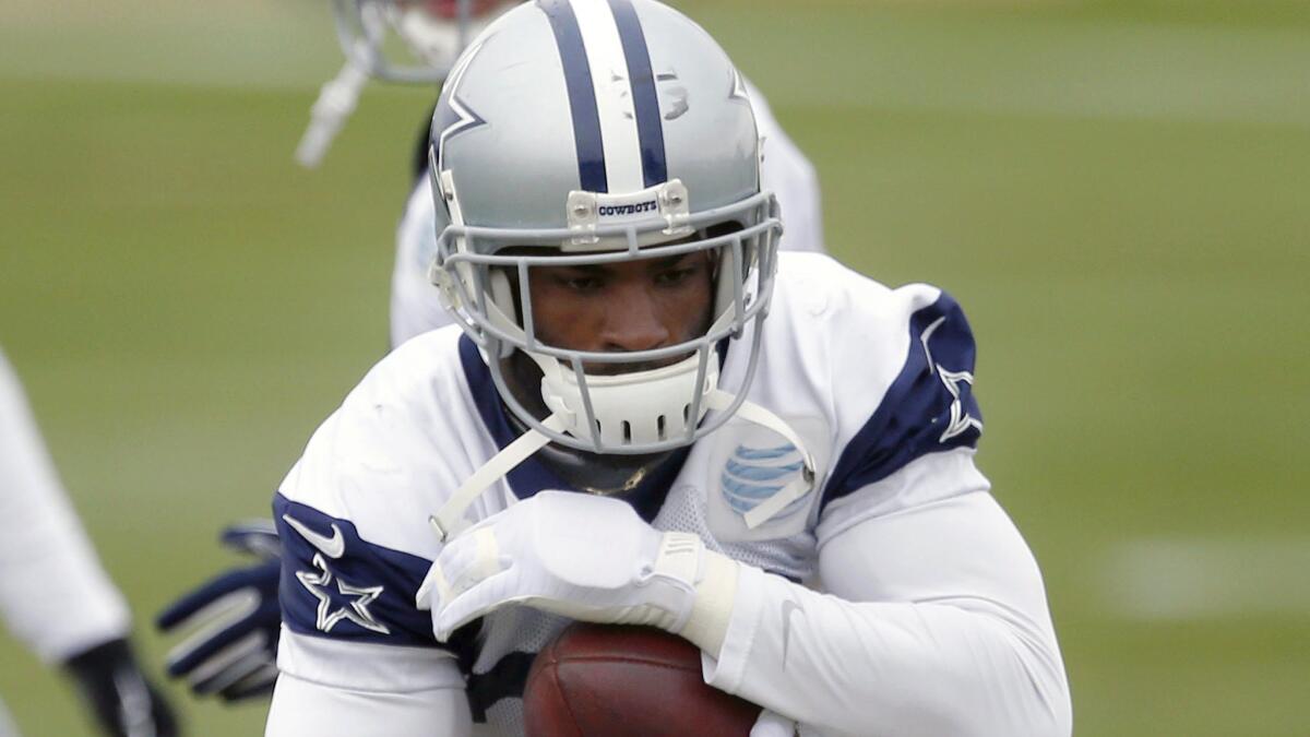 Dallas Cowboys running back DeMarco Murray carries the ball during drills at the team's practice facility in Irving, Texas, on Wednesday, two days after surgery to repair a broken bone in his left hand.