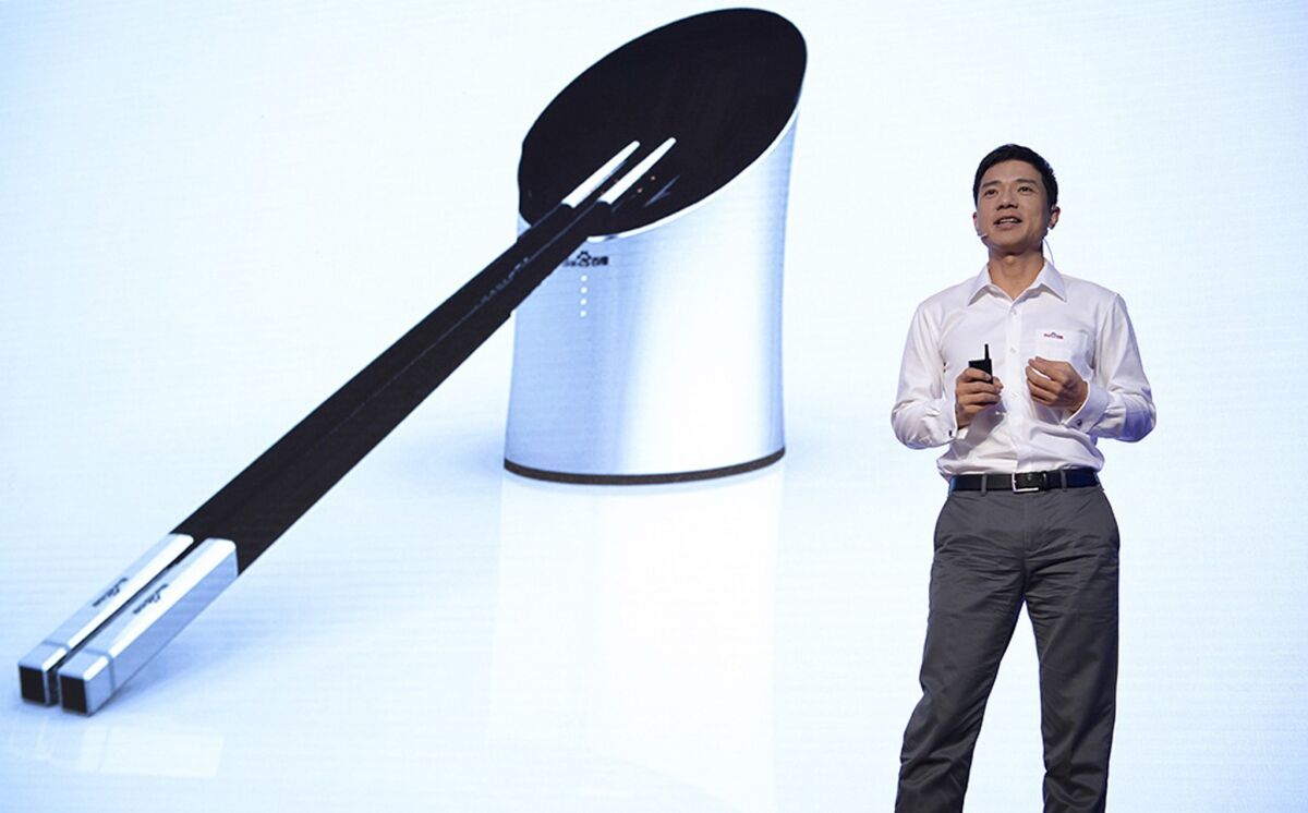 CEO Robin Li introduces Baidu's new "smart chopsticks" in Beijing this week.