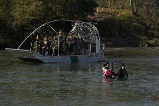 Border patrol agents watch as migrants cross the Rio Grande at the Texas-Mexico border, Wednesday, Jan. 3, 2024, in Eagle Pass, Texas. (AP Photo/Eric Gay)