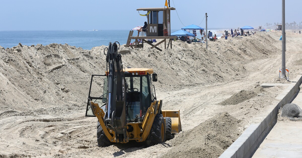 Newport Beach in cleanup mode after storm swell, high tide flood Balboa
