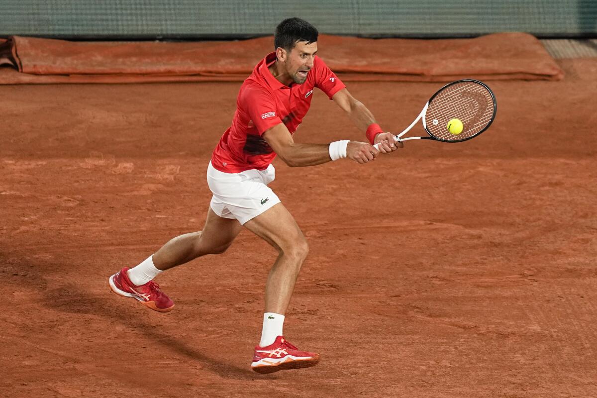 Serbia's Novak Djokovic plays a shot against Yoshihito Nishioka during their first-round match at the French Open on Monday.